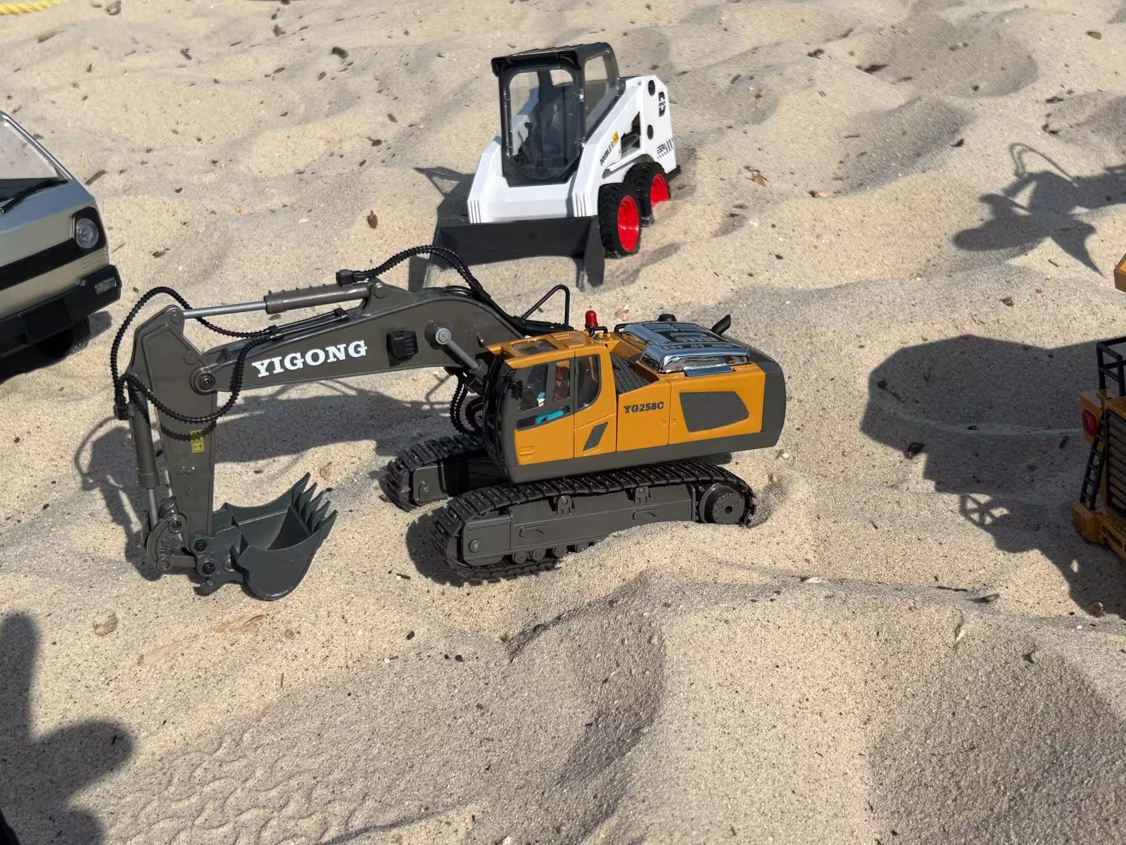 RC vehicles running under night lighting